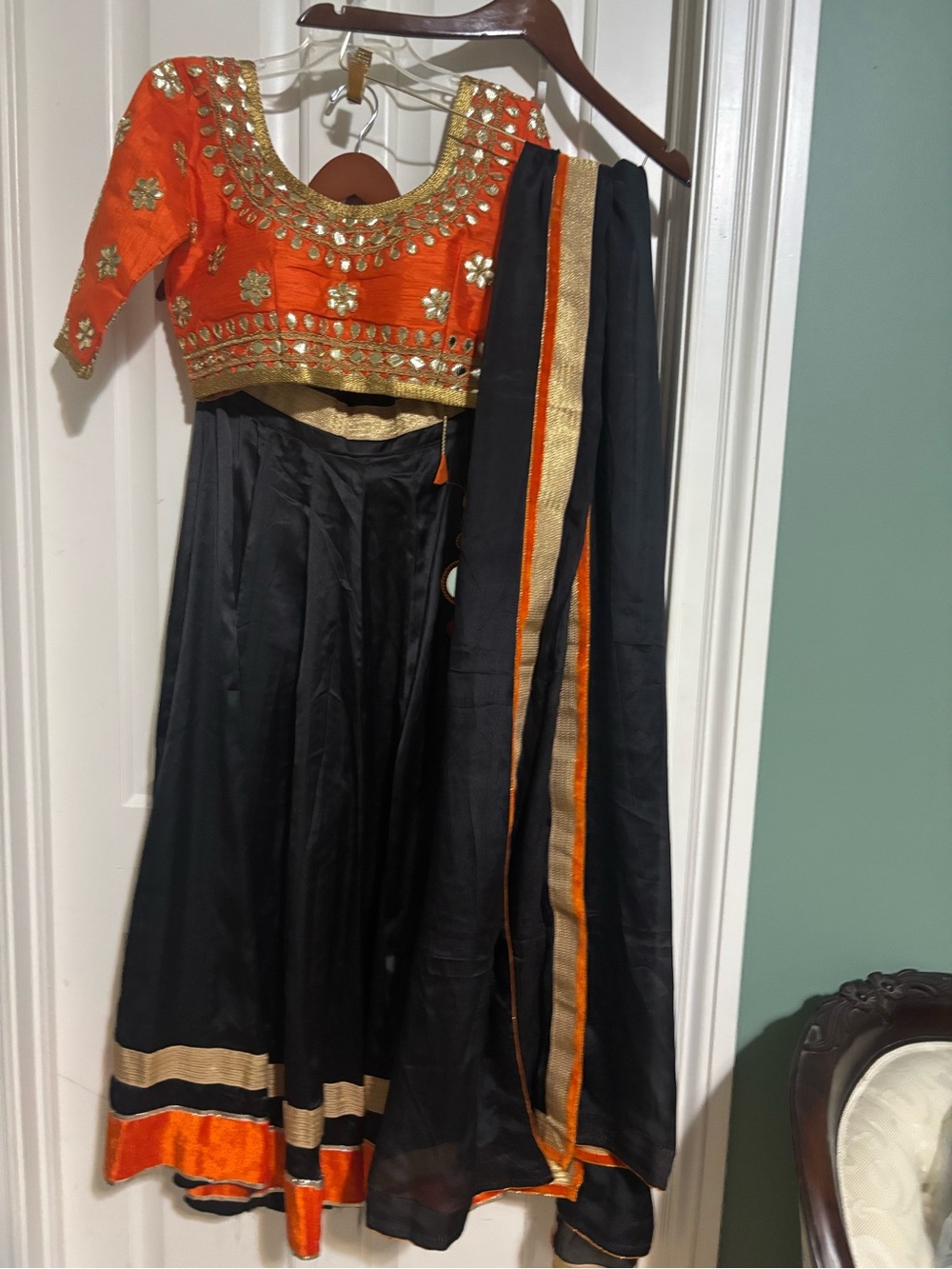 Beautiful new designer 3 piece Lehenga.Black and orange color large
